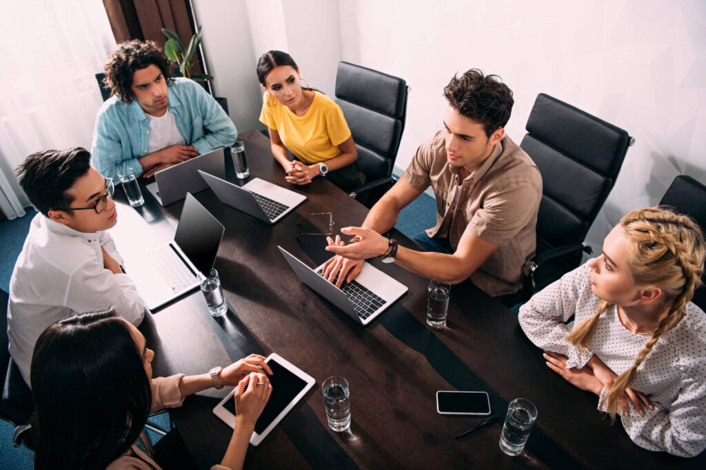 People sitting in conference room working